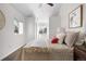 Bright bedroom with vaulted ceilings, featuring a comfortable bed with accent pillows and natural light at 4563 W 34Th Ave, Denver, CO 80212
