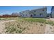 Wide shot of backyard space, showing the potential for landscaping and outdoor enjoyment at 1417 Bloom St, Brighton, CO 80601