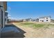 View of a backyard, partially landscaped, with view of surrounding homes at 1417 Bloom St, Brighton, CO 80601