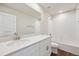 A spacious bathroom boasts double sinks, white cabinetry, and a shower-tub combination at 1417 Bloom St, Brighton, CO 80601