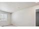 Bedroom with large window providing natural light and neutral colored walls at 1417 Bloom St, Brighton, CO 80601