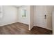 Cozy bedroom with modern flooring and a window offering ample natural light at 1417 Bloom St, Brighton, CO 80601