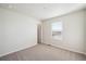 This room has carpet, baseboard trim, white walls, and a window at 1417 Bloom St, Brighton, CO 80601