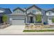 Charming two-story home with a well-maintained lawn, garage, and welcoming front porch at 1417 Bloom St, Brighton, CO 80601