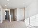 Bright upstairs hallway area with carpet, white walls, white doors, baseboard trim, and natural light at 1417 Bloom St, Brighton, CO 80601