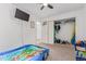 Bedroom features a closet with storage and mounted television at 7925 York St # 2, Denver, CO 80229