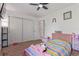 Bedroom featuring colorful bedding, closet space, carpet flooring, and plenty of natural light at 7925 York St # 2, Denver, CO 80229
