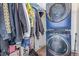 Laundry room contains a stacked washer and dryer unit at 7925 York St # 2, Denver, CO 80229