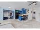 Bright living room featuring new carpet, bar stool seating, blue walls and a ceiling fan at 7925 York St # 2, Denver, CO 80229