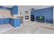 Open concept living room featuring a fireplace, breakfast bar, and an aquarium at 7925 York St # 2, Denver, CO 80229