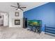 Cozy living room features a fireplace, an aquarium, and a ceiling fan at 7925 York St # 2, Denver, CO 80229