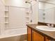 Bright bathroom with a shower-tub combo featuring a detachable shower head and lots of storage at 20768 Randolph, Denver, CO 80249