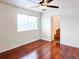 Bright bedroom featuring hardwood floors, a ceiling fan, and a window with blinds at 20768 Randolph, Denver, CO 80249