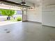 Clean garage with an open door showcasing the home's exterior at 20768 Randolph, Denver, CO 80249