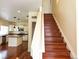 Beautiful staircase with hardwood steps and view to the kitchen at 20768 Randolph, Denver, CO 80249