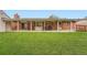 Spacious backyard features a covered patio at 678 S Oswego Ct, Aurora, CO 80012