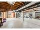 Unfinished basement with mechanicals and laundry area at 678 S Oswego Ct, Aurora, CO 80012