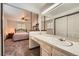 En-suite bathroom vanity with a view of the bedroom at 678 S Oswego Ct, Aurora, CO 80012