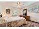 Bedroom with carpet flooring, ceiling fan, dresser, and large window with shutters at 678 S Oswego Ct, Aurora, CO 80012
