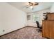 Bedroom features carpet flooring and a large window with shutters at 678 S Oswego Ct, Aurora, CO 80012