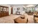Open floor plan features a decorative hutch, carpeted floors, and dining area at 678 S Oswego Ct, Aurora, CO 80012