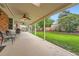Covered patio space overlooks the backyard at 678 S Oswego Ct, Aurora, CO 80012
