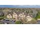 Residential area with diverse housing and a clear blue sky backdrop at 9390 W Chatfield Pl # 104, Littleton, CO 80128