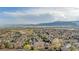 Sweeping vista of a residential area with mountains in the distance at 9390 W Chatfield Pl # 104, Littleton, CO 80128