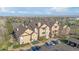 Attractive apartment building with balconies, lush greenery, and parking at 9390 W Chatfield Pl # 104, Littleton, CO 80128