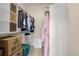 Walk-in closet with shelves, hanging clothes, and storage containers at 9390 W Chatfield Pl # 104, Littleton, CO 80128