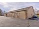 Attached garages with brick accents and individual parking spaces at 9390 W Chatfield Pl # 104, Littleton, CO 80128