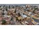 Drone shot of the neighborhood, showing a variety of houses and nearby local amenities at 3344 S Uinta Ct, Denver, CO 80231