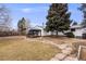 Spacious backyard featuring a charming gazebo and stone pathway, perfect for outdoor entertaining at 3344 S Uinta Ct, Denver, CO 80231