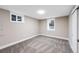 Carpeted bedroom featuring two windows for natural light and a neutral color palette at 3344 S Uinta Ct, Denver, CO 80231