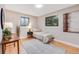 Cozy bedroom featuring natural light, wood floors, and a comfortable space at 3344 S Uinta Ct, Denver, CO 80231