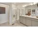 Modern bathroom with dual sinks, a walk-in shower, and neutral color scheme at 1885 Mount Monroe Dr, Berthoud, CO 80513