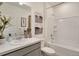 Bright bathroom featuring a large vanity with sink and a shower over tub at 1885 Mount Monroe Dr, Berthoud, CO 80513