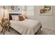 This is a bedroom with a queen bed, a nightstand, and modern art on the wall at 1885 Mount Monroe Dr, Berthoud, CO 80513