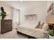 Well-lit bedroom featuring neutral decor, carpet floors, and comfortable bedding at 1885 Mount Monroe Dr, Berthoud, CO 80513