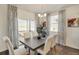 Elegant dining room with stylish curtains and modern chandelier lighting at 1885 Mount Monroe Dr, Berthoud, CO 80513
