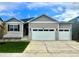 Charming two-story home with a three car garage and manicured lawn at 1885 Mount Monroe Dr, Berthoud, CO 80513