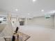 Spacious finished basement with neutral carpet and light filled bar area at 6953 S Prescott St, Littleton, CO 80120