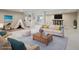 Spacious finished basement featuring living area with neutral carpet and plenty of natural light at 6953 S Prescott St, Littleton, CO 80120