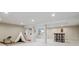 Large basement featuring neutral carpet and an entertaining space with a wet bar at 6953 S Prescott St, Littleton, CO 80120