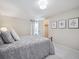 Comfortable bedroom with neutral walls, carpet floors, closet and charming wall art at 6953 S Prescott St, Littleton, CO 80120