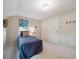 Neutral toned bedroom with a nautical theme, twin bed, and closet at 6953 S Prescott St, Littleton, CO 80120
