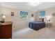 Inviting bedroom featuring bright windows, a comfy twin bed and carpet floors at 6953 S Prescott St, Littleton, CO 80120