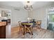 Inviting dining room showcasing round table and entry to kitchen at 6953 S Prescott St, Littleton, CO 80120