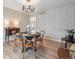 Stylish dining room with round table, chairs, and modern chandelier at 6953 S Prescott St, Littleton, CO 80120