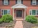 Inviting front entrance with double doors, trimmed with sidelights and a brick path leading to the street at 6953 S Prescott St, Littleton, CO 80120